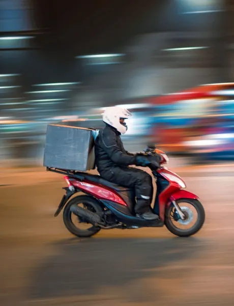 Customer receving food delivery from rider